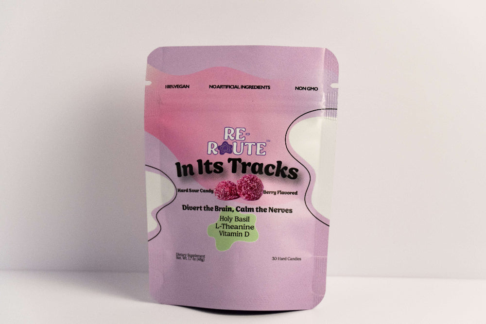Purple package of 'RE-Route in its Tracks' on a white background